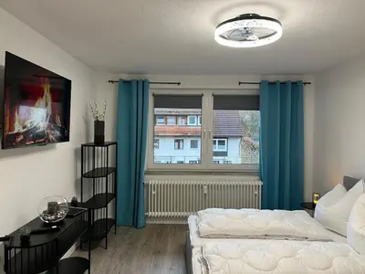 Ein Bett oder Betten in einem Zimmer der Unterkunft Ferienwohnung Bergwurm DX mit Balkon