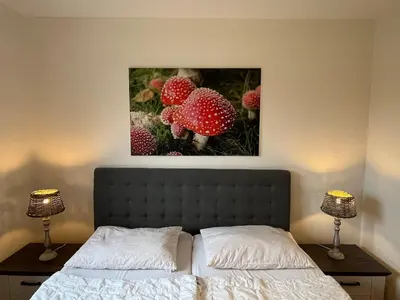 Ein Bett oder Betten in einem Zimmer der Unterkunft Ferienwohnung Harzpause mit Balkon & Sauna - Ferienresidenz Wurmbergblick