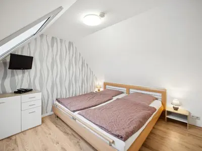 Ein Bett oder Betten in einem Zimmer der Unterkunft Harzblick