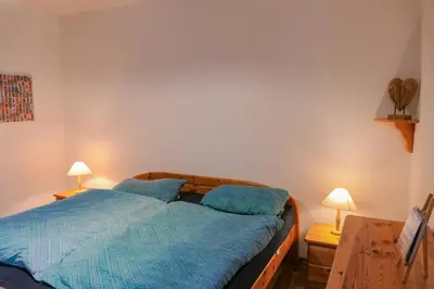 Ein Bett oder Betten in einem Zimmer der Unterkunft Selbstversorger-FeWo in Hohegeiß mit Terrasse und eigenem Eingang