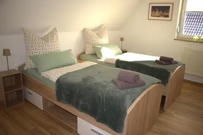 Ein Bett oder Betten in einem Zimmer der Unterkunft Ferienhaus Sonnenblick Wernigerode