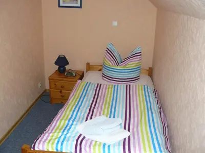 Ein Bett oder Betten in einem Zimmer der Unterkunft Haus Vier Jahreszeiten