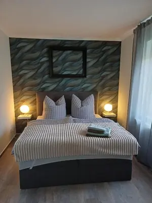 Ein Bett oder Betten in einem Zimmer der Unterkunft FeWo Sasa