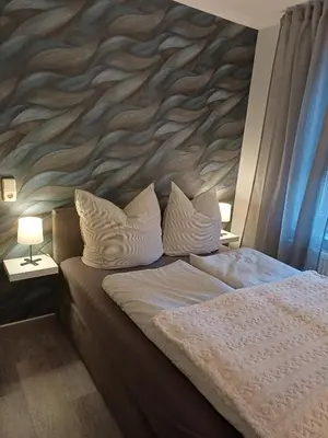 Ein Bett oder Betten in einem Zimmer der Unterkunft FeWo Sasa