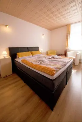 Ein Bett oder Betten in einem Zimmer der Unterkunft Pension und China - Thai Restaurant Asia - Haus