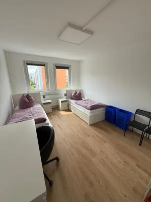 Ein Bett oder Betten in einem Zimmer der Unterkunft Doppelzimmer in Wernigerode