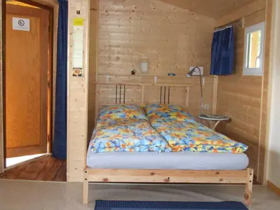 Ein Bett oder Betten in einem Zimmer der Unterkunft Ferienhaus Walnuss-Hütte
