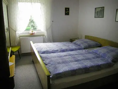 Ein Bett oder Betten in einem Zimmer der Unterkunft Ferienwohnung Gusmag