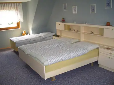 Ein Bett oder Betten in einem Zimmer der Unterkunft Ferienwohnung Kramer in Göttingerode