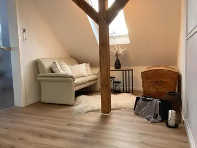 Ein Sitzbereich in der Unterkunft Ferienwohnungen bei der Purpurbuche