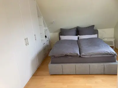 Ein Bett oder Betten in einem Zimmer der Unterkunft Ferienwohnungen bei der Purpurbuche