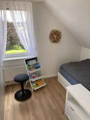 Ein Bett oder Betten in einem Zimmer der Unterkunft Ferienwohnungen bei der Purpurbuche
