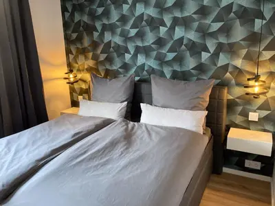 Ein Bett oder Betten in einem Zimmer der Unterkunft Ferienwohnungen bei der Purpurbuche