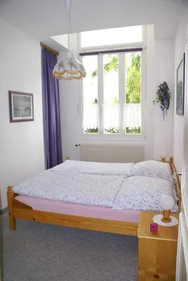 Ein Bett oder Betten in einem Zimmer der Unterkunft Ferienwohnung Residenz am Badepark Nikolaus