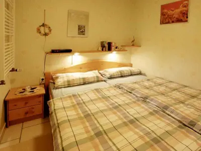 Ein Bett oder Betten in einem Zimmer der Unterkunft Ferienwohnung Tuchtefeld