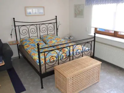 Ein Bett oder Betten in einem Zimmer der Unterkunft Ferienwohnung Glück Auf