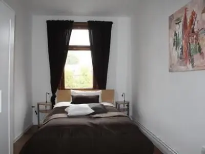 Ein Bett oder Betten in einem Zimmer der Unterkunft Apartment Gemütliche Wohnung in Wernigerode mit Garten by Interhome