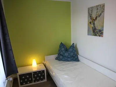 Ein Bett oder Betten in einem Zimmer der Unterkunft Apartment Wohnung Julius 3 - gemütlich und kinderfreundlich by Interhome