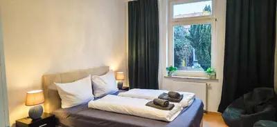 Ein Bett oder Betten in einem Zimmer der Unterkunft Großzügiges City-Apartment für 8 Gäste mit Parkplatz im Zentrum Wernigerode