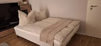 Ein Bett oder Betten in einem Zimmer der Unterkunft Ferienwohnung unter der Hammwarte