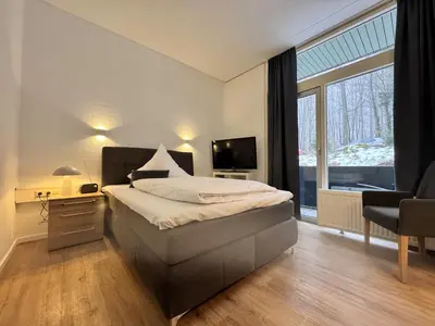 Ein Bett oder Betten in einem Zimmer der Unterkunft Kurhaus im Harz - Bad Harzburg