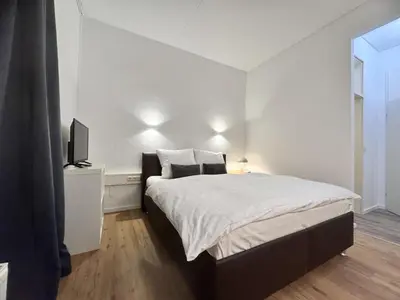 Ein Bett oder Betten in einem Zimmer der Unterkunft Kurhaus im Harz - Bad Harzburg