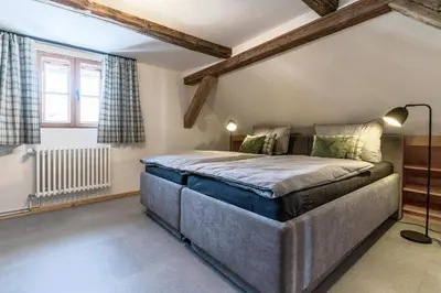 Ein Bett oder Betten in einem Zimmer der Unterkunft Villa Moock- gemütlich wohnen im Denkmal von 1766