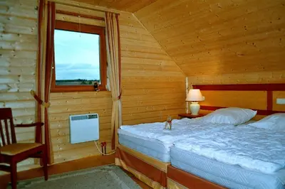 Ein Bett oder Betten in einem Zimmer der Unterkunft Gemütliches Ferienhaus mit Terrasse - Ferienhäuser Auerhahn