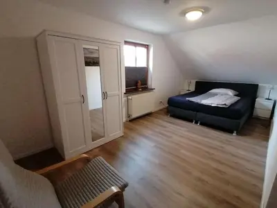 Ein Bett oder Betten in einem Zimmer der Unterkunft Ferienwohnung HarzErlebnis