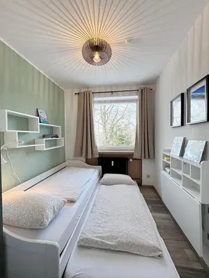 Ein Bett oder Betten in einem Zimmer der Unterkunft Waldfee