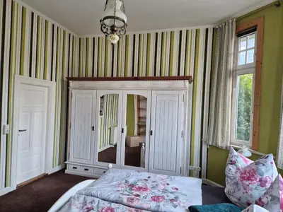 Ein Bett oder Betten in einem Zimmer der Unterkunft Elegante Altbauwohnung mit Schlossblick und Parkplatz