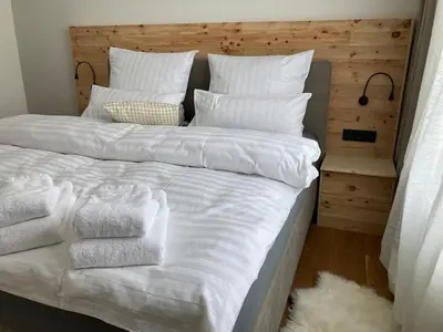 Ein Bett oder Betten in einem Zimmer der Unterkunft Villa Schlossblick III - Zeit zum Träumen in exklusiver Suite 