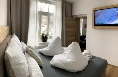 Ein Bett oder Betten in einem Zimmer der Unterkunft Villa Schlossblick III - Zeit zum Träumen in exklusiver Suite 