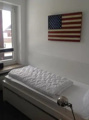 Ein Bett oder Betten in einem Zimmer der Unterkunft Ferienwohnung Hampton