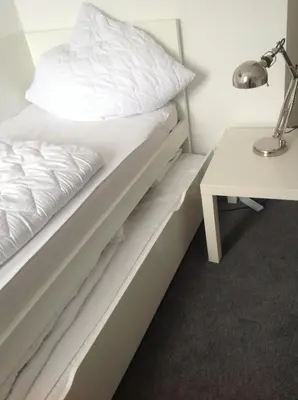 Ein Bett oder Betten in einem Zimmer der Unterkunft Ferienwohnung Hampton