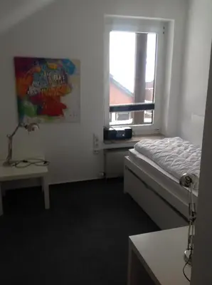 Ein Bett oder Betten in einem Zimmer der Unterkunft Ferienwohnung Hampton