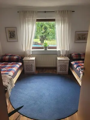 Ein Bett oder Betten in einem Zimmer der Unterkunft Ferienhaus Hülser