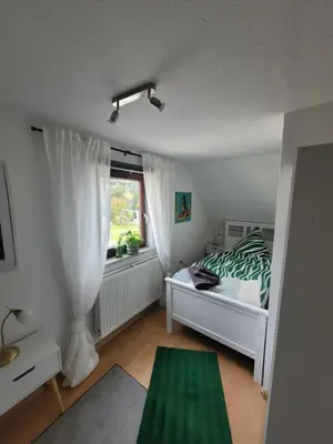 Ein Bett oder Betten in einem Zimmer der Unterkunft Ferienhaus Hülser