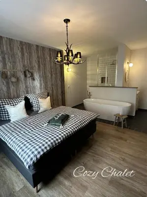 Ein Bett oder Betten in einem Zimmer der Unterkunft Cozy Chalet