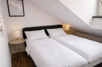 Ein Bett oder Betten in einem Zimmer der Unterkunft PrimeLoft 