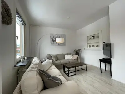 Ein Sitzbereich in der Unterkunft Hyggeliges Apartment 