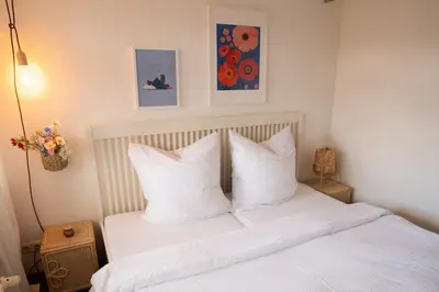 Ein Bett oder Betten in einem Zimmer der Unterkunft Hyggeleben, Innenstadt, Schlossblick, Parkplatz