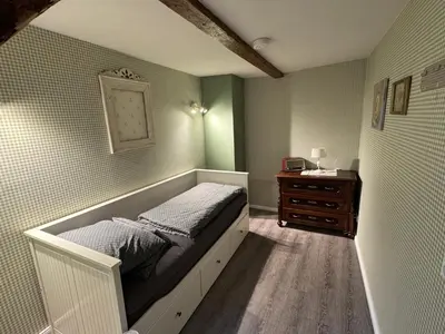 Ein Bett oder Betten in einem Zimmer der Unterkunft Himmel & Hölle Pölkenstraße