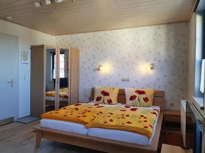 Ein Bett oder Betten in einem Zimmer der Unterkunft Haus am Kurpark