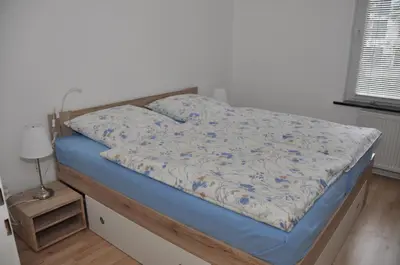 Ein Bett oder Betten in einem Zimmer der Unterkunft Ferienwohnung Martin 1