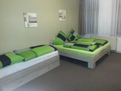 Ein Bett oder Betten in einem Zimmer der Unterkunft Ferienwohnung am Markt