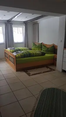 Ein Bett oder Betten in einem Zimmer der Unterkunft Harz Stolberg Ferienwohnung