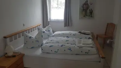Ein Bett oder Betten in einem Zimmer der Unterkunft Harz Stolberg Ferienwohnung