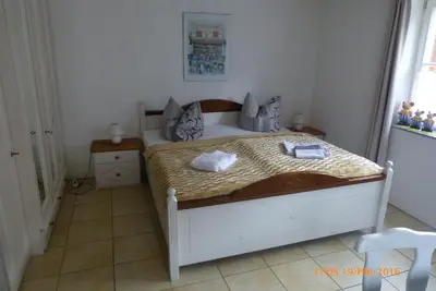 Ein Bett oder Betten in einem Zimmer der Unterkunft Harz Stolberg Ferienwohnung