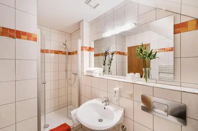 Ein Badezimmer in der Unterkunft Hotel Achtermann